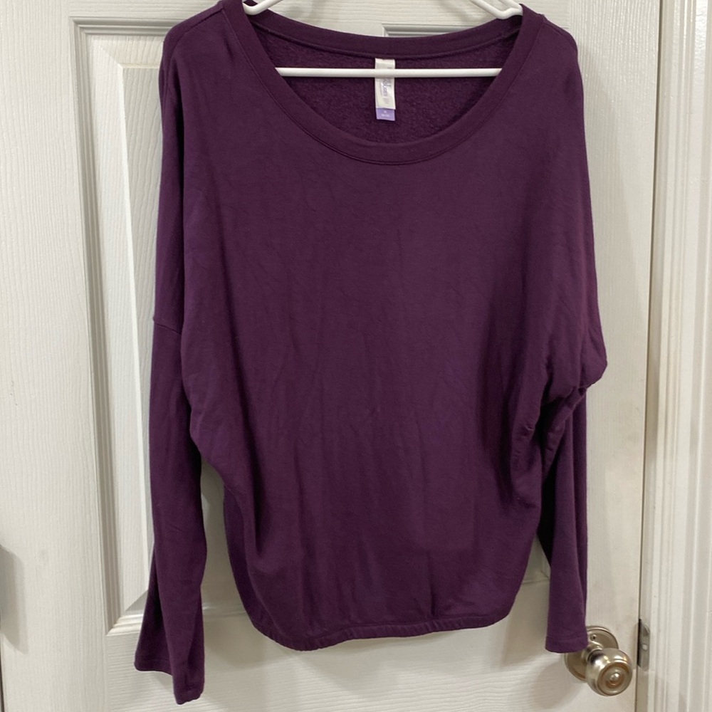 Purple sweat shirt.